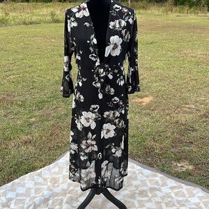 Black sheer bell sleeve floral dress cover. No tag. Fits like a small.